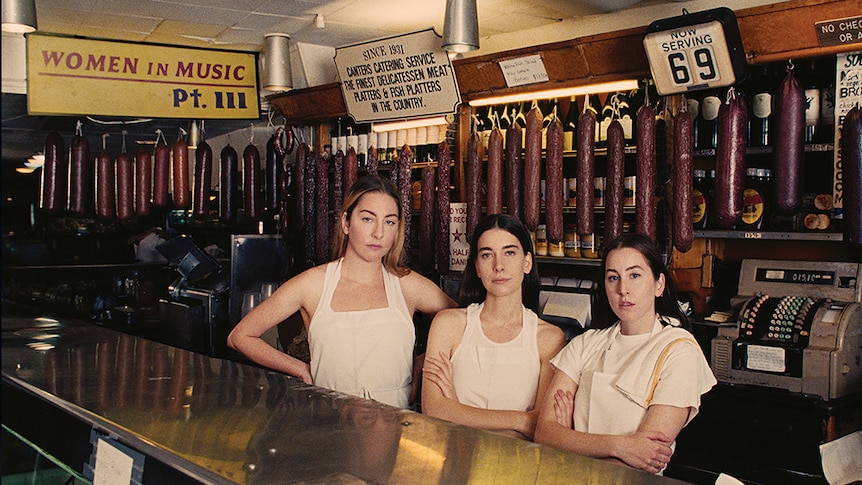 Haim in Canter's Deli in a photo for the cover of their 2020 album Women in Music Pt. III