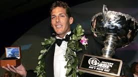Andy Irons accepting one his world title trophies