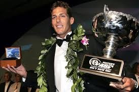 Andy Irons accepting one his world title trophies