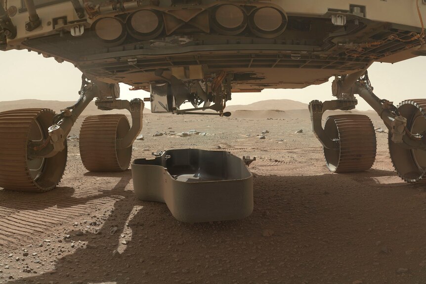 A shot of the underside of a space rover on Mars.