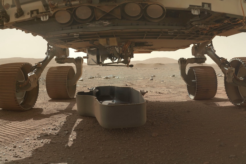 A shot of the underside of a space rover on Mars.