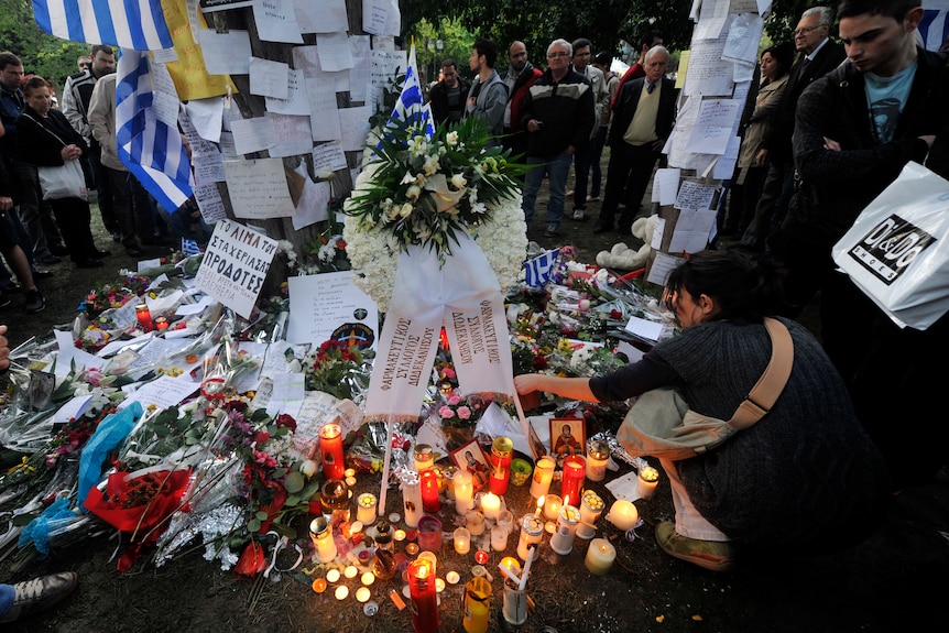 Flowers laid for Greek pensioner