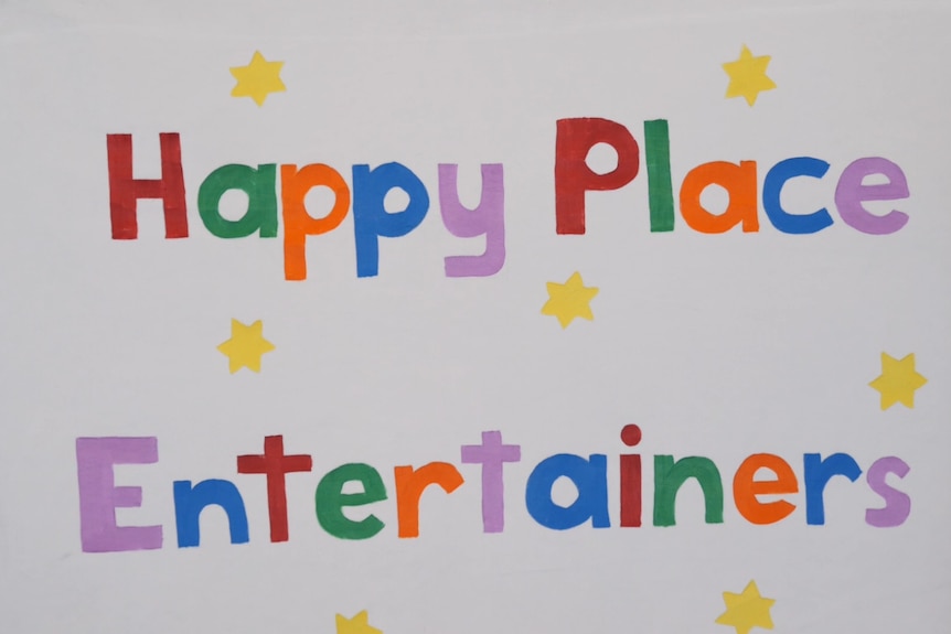 Sign reading 'Happy Place Entertainers'