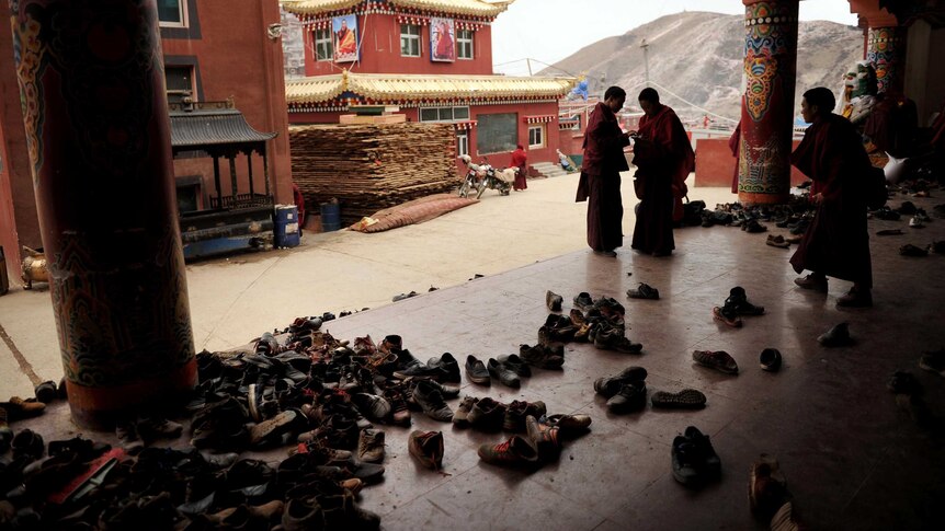 Apprentice Buddhist monks leave their shoes outside before a debating session at Seda Monastery.