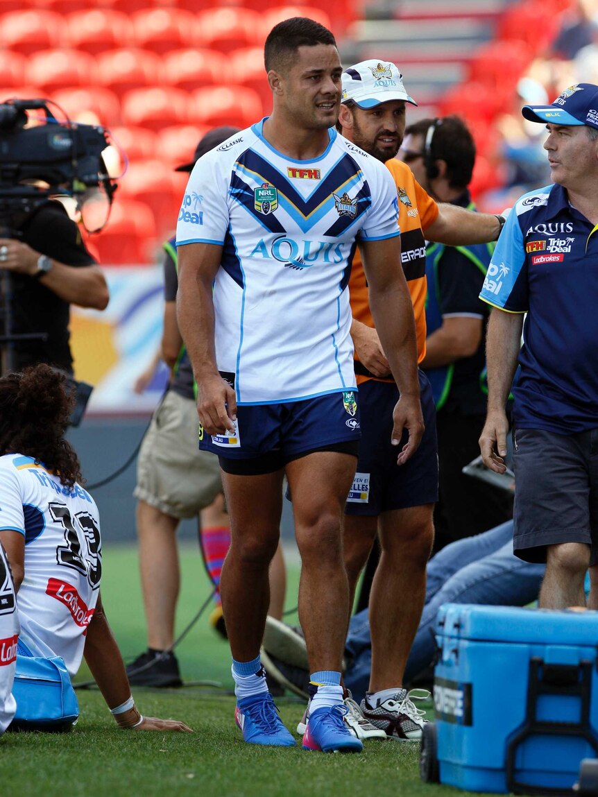 Jarryd Hayne leaves the field for the Titans in Newcastle after injuring his ankle.