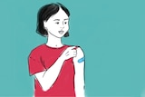 Woman with rolled-up sleeve after receiving a vaccine.
