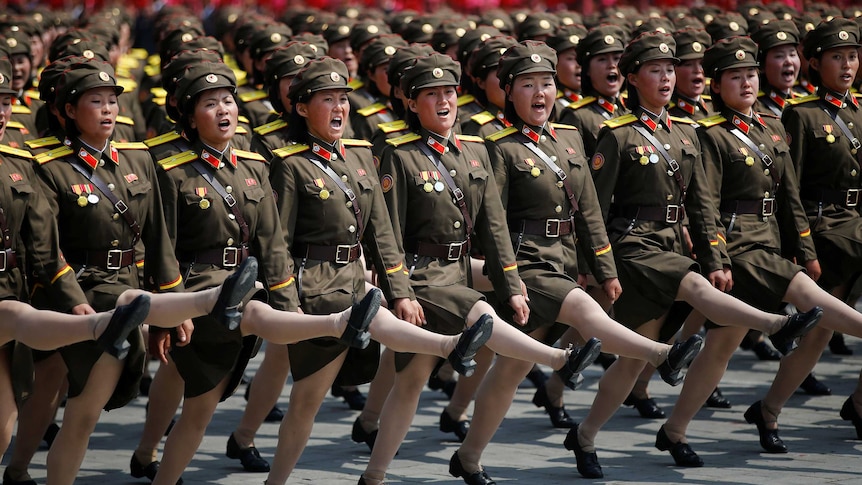 North Korean soldiers march and shout slogans during a military parade marking the 105th birth anniversary of country's founding father Kim Il Sung in Pyongyang, North Korea.