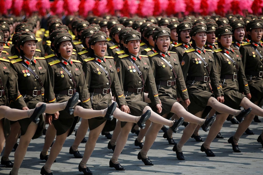 North Korean soldiers march and shout slogans during a military parade marking the 105th birth anniversary of country's founding father Kim Il Sung in Pyongyang, North Korea.