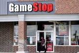 The exterior of a brick building with a sign saying GameStop.