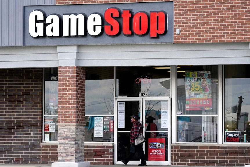 The exterior of a brick building with a sign saying GameStop.
