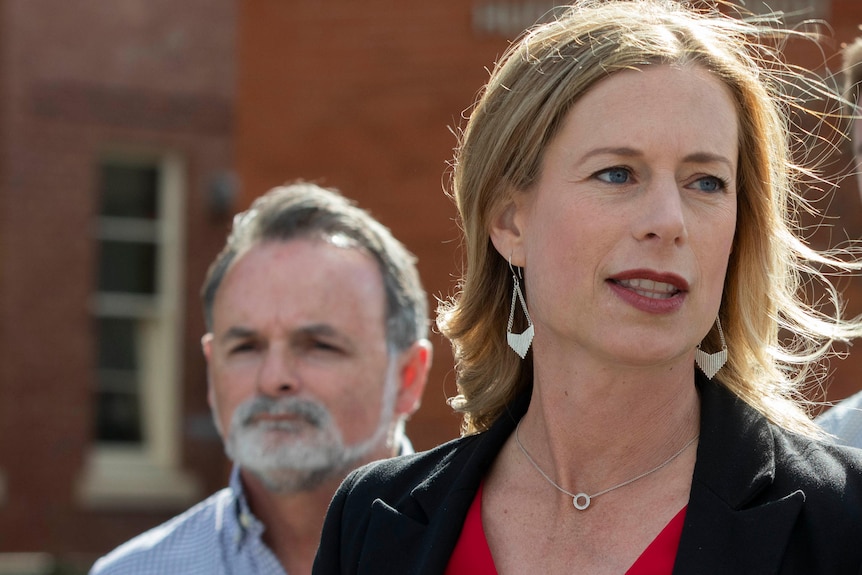 David O'Byrne and Rebecca White stand together but apart.