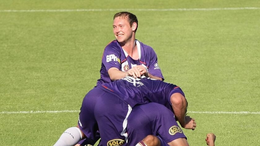 Daniel McBreen celebrates with his Glory team-mates after Jukic's goal.