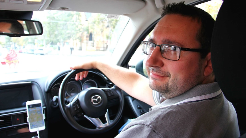 A man driving a car