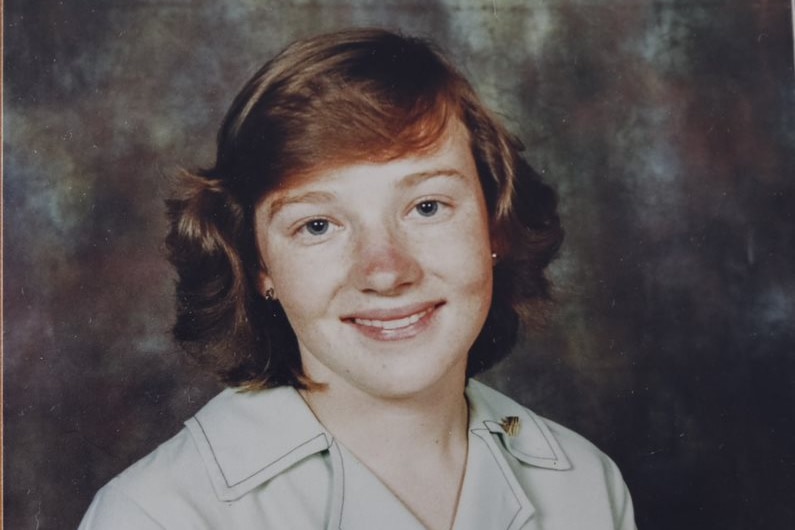 Historical photo of young girl in a school uniform