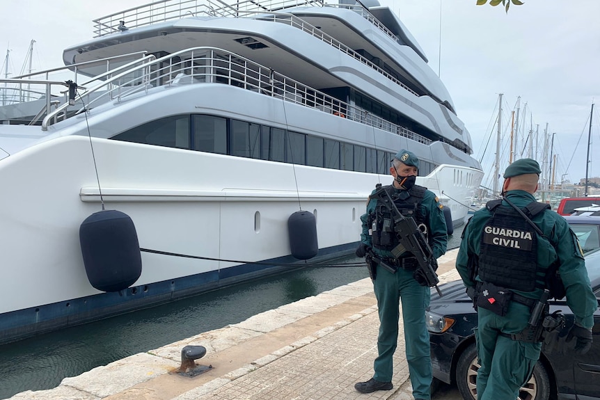 Spanish Civil Guards stand by the Tango superyacht, belonging to Russian oligarch Viktor Vekselberg.