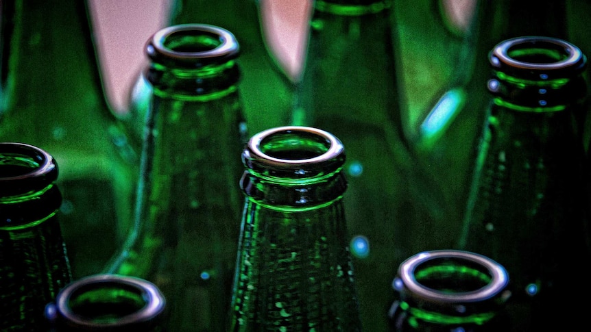 A number of green glass bottles.