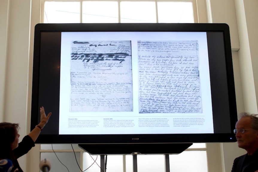 Large screen showing hidden pages of Anne Frank's diary