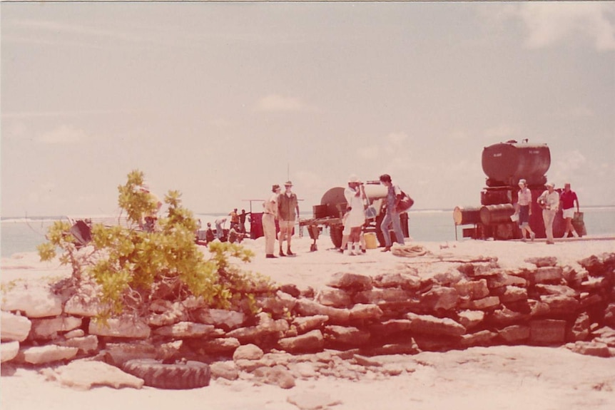 People arriving on an Island in the Enewetak Atoll, in the Marshall Islands.