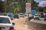 Congestion on M1 with 80kph and roadwork signs.