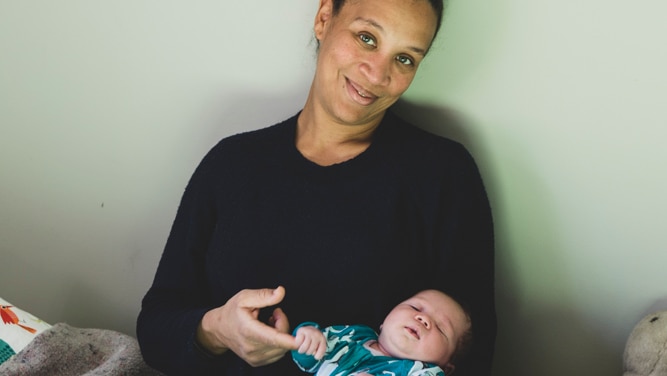 Vanessa Pidwell from Newstead, sits with her newborn baby boy Teilo in her lap.