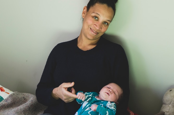 Vanessa Pidwell from Newstead, sits with her newborn baby boy Teilo in her lap.