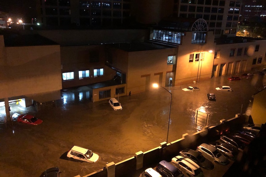 Aerial view of cars floating in a flooded Hobart street