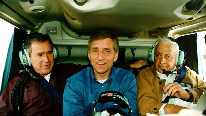 Israeli defence minister Ariel Sharon flies in a helicopter with Texas governor George Bush and Utah governor Mike Leavitt.