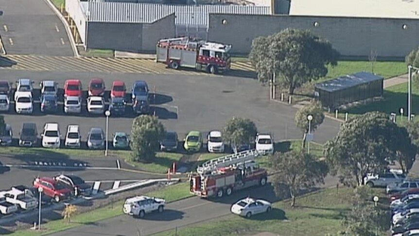 Exterior pic of Barwon Prison with two fire trucks on scene