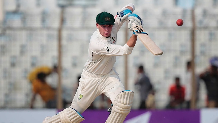 Australia's Peter Handscomb drives against Bangladesh