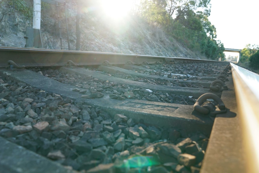 The sun bounces off train tracks in Kempsey in regional New South Wales