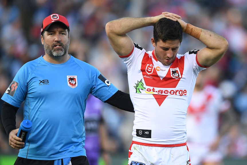 A St George Illawarra NRL player is assisted from the field after suffering a head knock.