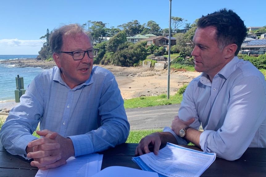 Dr Michael Holland sits with the Opposition leader Chris Minns at Bega