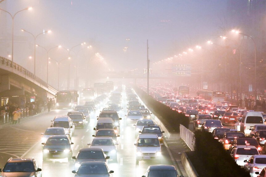 Thick fog hangs over busy freeway in Beijing.