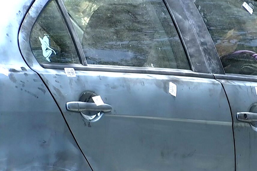 Toyah Cordingley's car which was found at Wangetti Beach, covered in fingerprint dust and forensic markers.