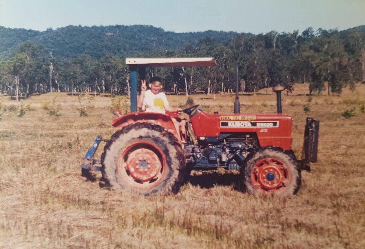 Historic photo of Durnford Dart on a tractor before he started planting bamboo.