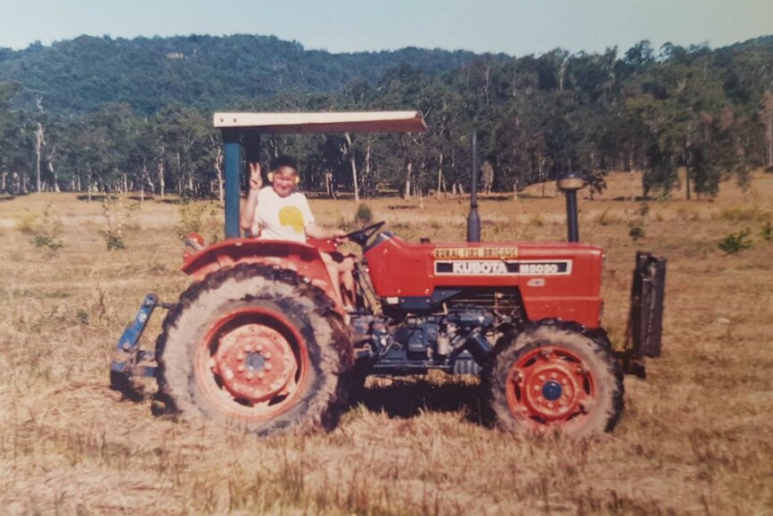 Historic photo of Durnford Dart on a tractor before he started planting bamboo.