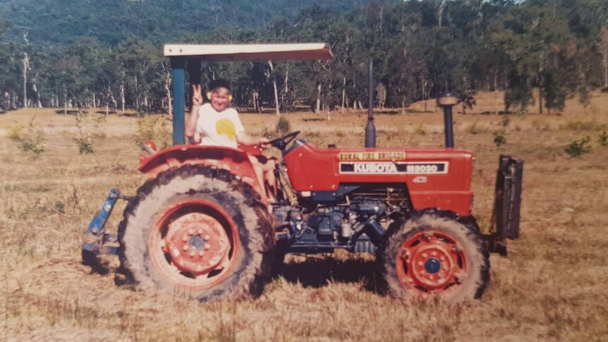 Historic photo of Durnford Dart on a tractor before he started planting bamboo.