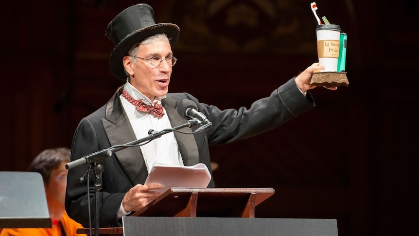 Marc Abrahams presents an Ig Nobel Prize.