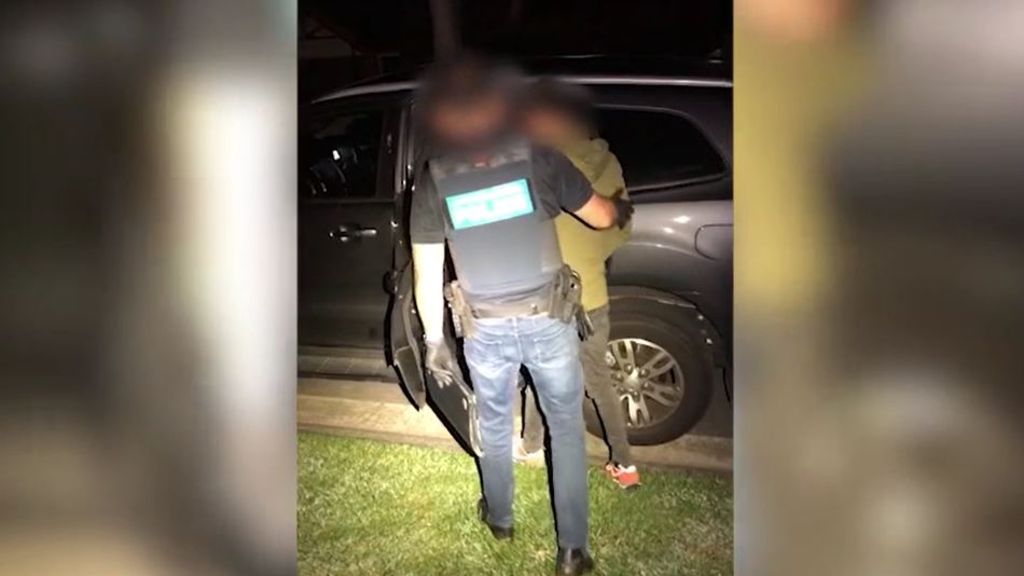 A man being arrested by police.