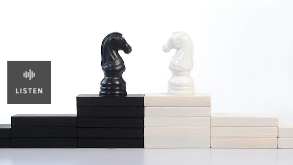 Black and white chess knight pieces facing each other. Has Audio.