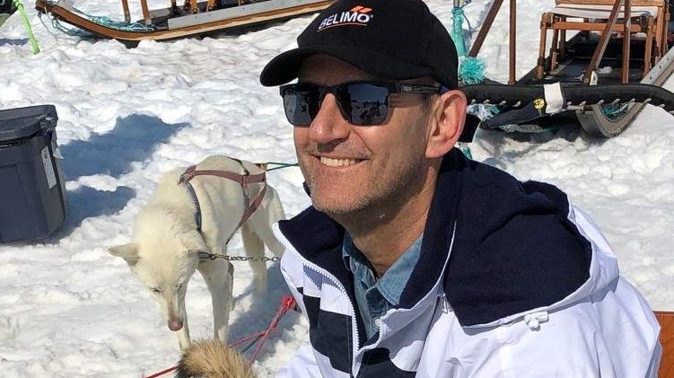 Man on a dog sled in Alaska