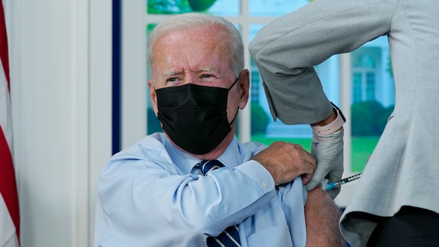 US President Joe Biden receives a vaccine shot