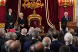 King Charles III speaks as Camilla and Prince William look on at St James's Palace during his accession ceremony