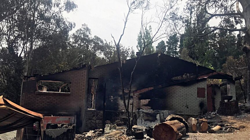 Bllack marks show the damage to the outside of a brick house in Cudlee Creek