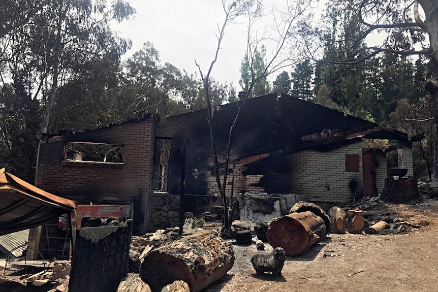 Bllack marks show the damage to the outside of a brick house in Cudlee Creek