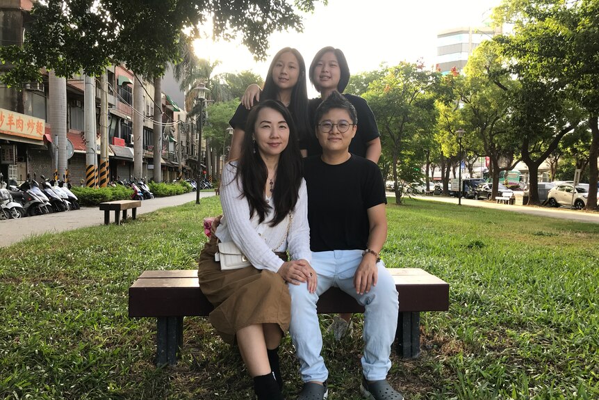 A photo of four women - two adults and two children - in a park in Taiwan.
