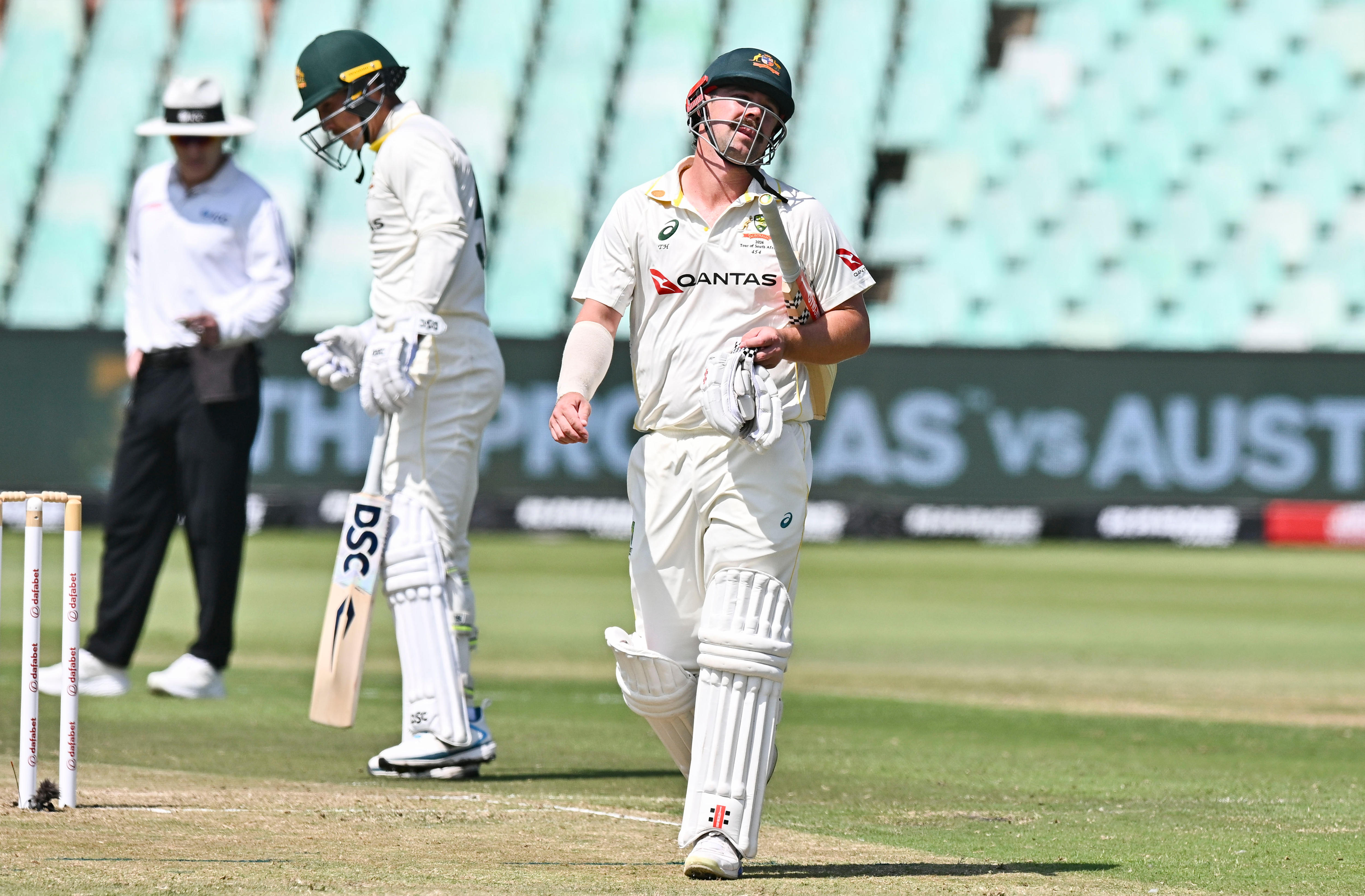 Travis Head throws his head back in frustration as he walks off after getting out in a Test.