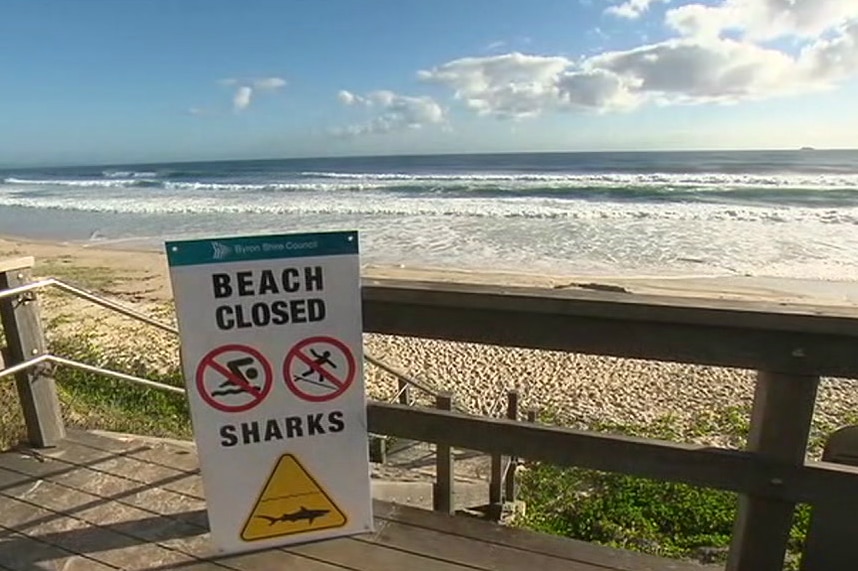 A sign saying the beach is closed