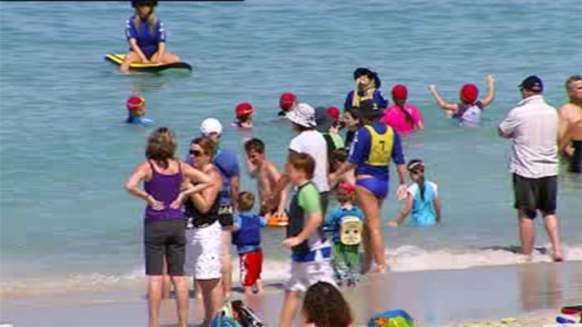 Beachgoers try to beat Perth's heatwave at Sorrento beach.