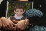 Mother of holds photo of son killed in Newtown shooting
